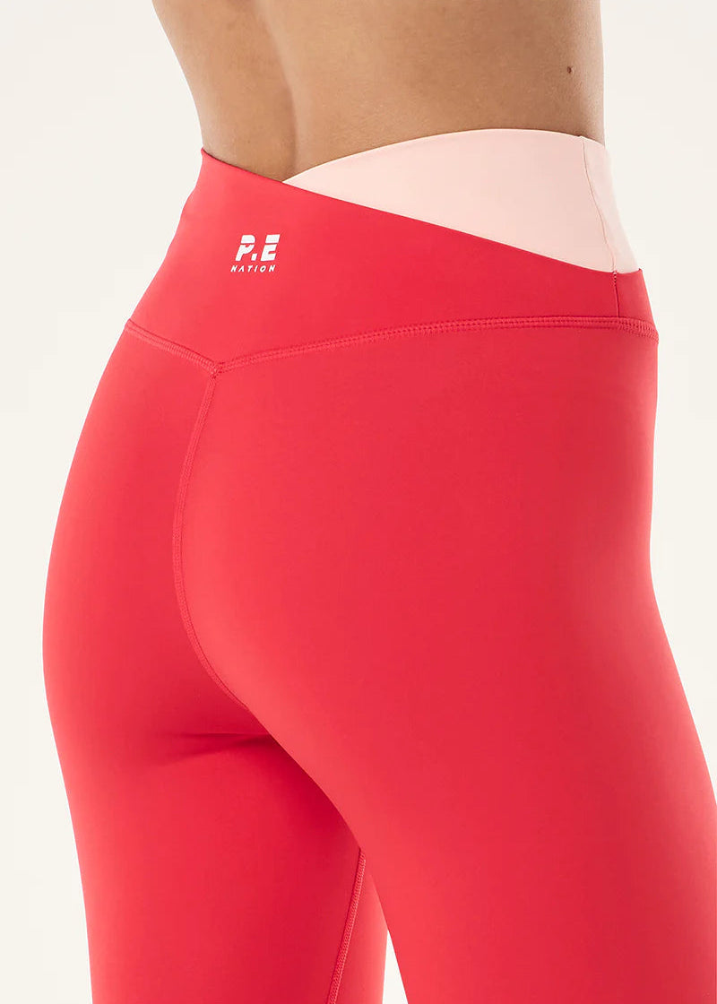 Red leggings with a brand logo on a white background