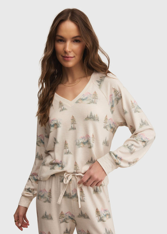 Woman wearing a floral pajama set on a white background