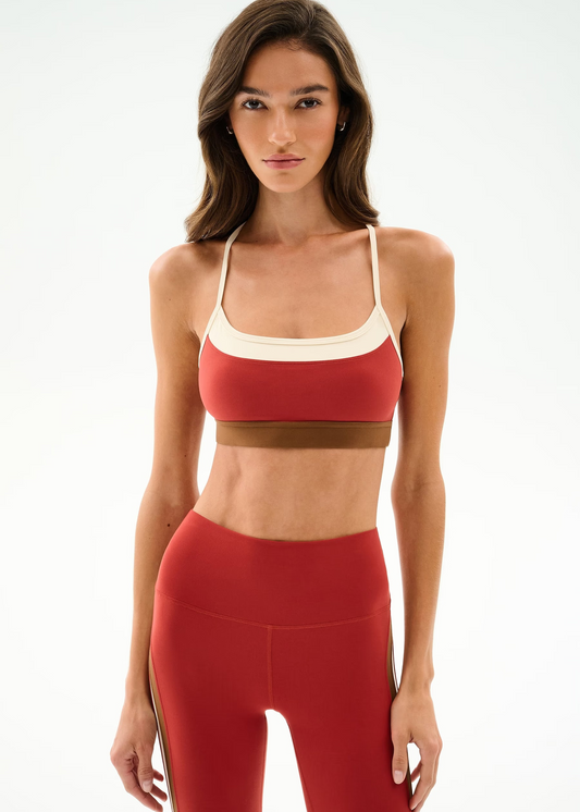 woman wearing sports bra in terracotta 