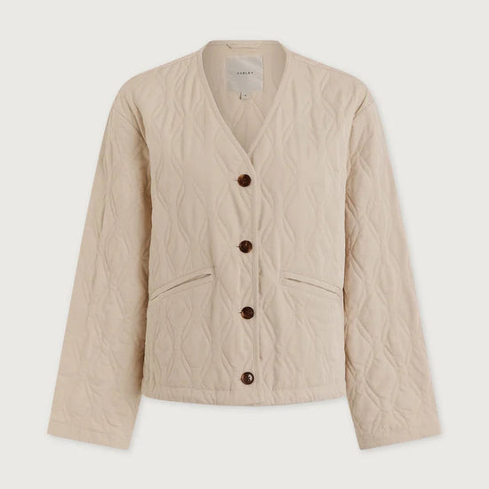 Beige quilted jacket with button details on a white background