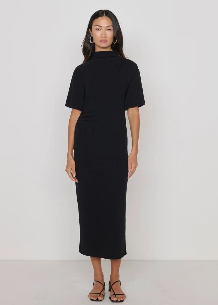 woman wearing long knit black dress short sleeved