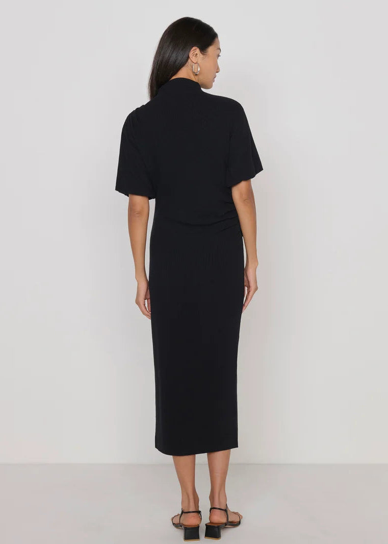 woman wearing long knit black dress short sleeved