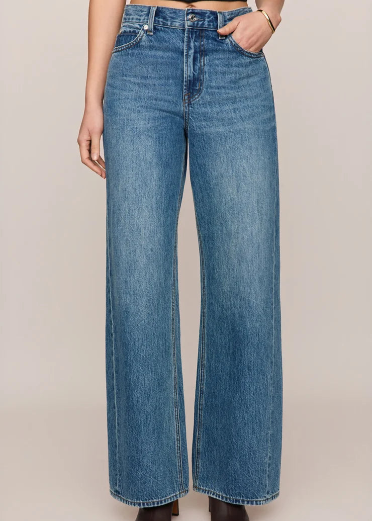 front view of women’s medium-wash high-rise wide-leg jeans with patch pockets, available at Ekam boutique Newport Beach