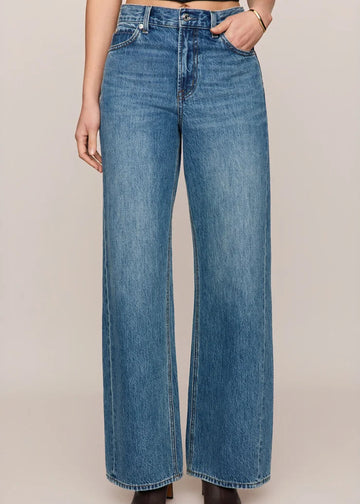 front view of women’s medium-wash high-rise wide-leg jeans with patch pockets, available at Ekam boutique Newport Beach