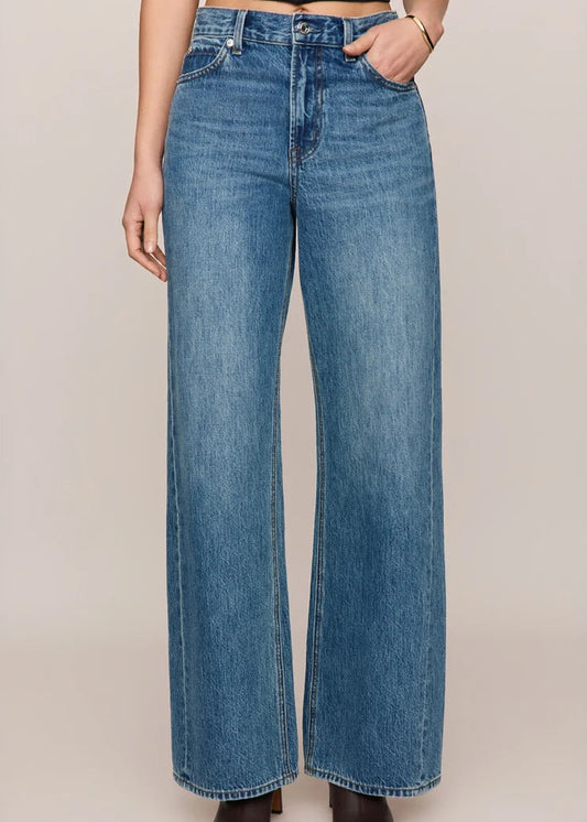 front view of women’s medium-wash high-rise wide-leg jeans with patch pockets, available at Ekam boutique Newport Beach
