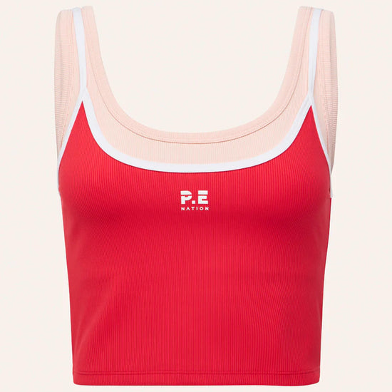Red sports bra with white straps on a light pink background