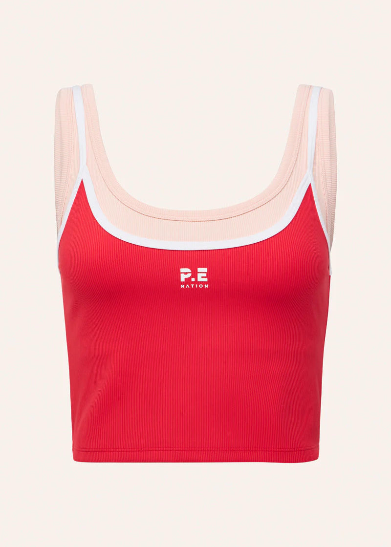 Red sports bra with white straps on a light pink background