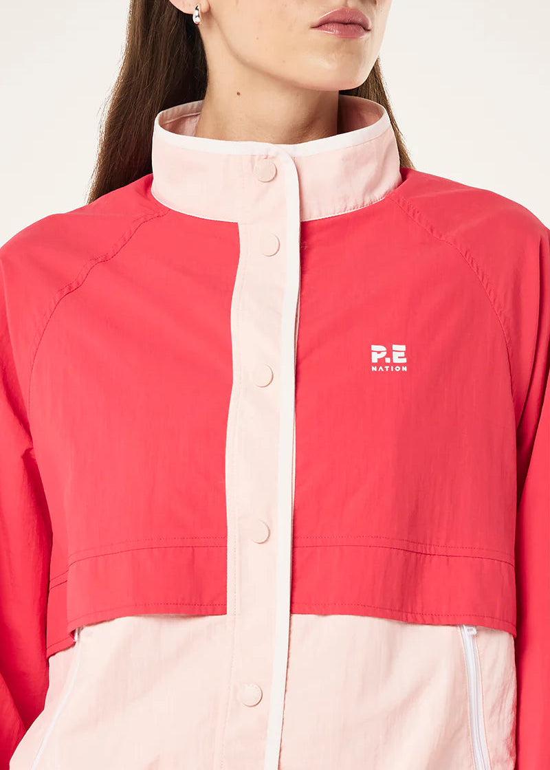 Red and pink jacket with a brand logo on a white background