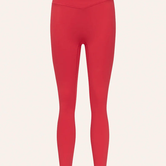 Red leggings on a light pink background