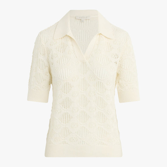 Cream-colored ribbed knit shirt on a white background